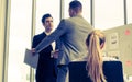 Business man with handshake with partner and woman cheering Royalty Free Stock Photo