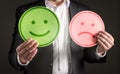 Business man with happy smiling and sad unhappy faces. Royalty Free Stock Photo