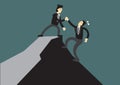 Business man helping another to reach the top of the cliff. Business concept of teamwork, leadership or relationship.