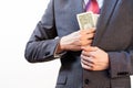 Business man hiding money in jacket pocket Royalty Free Stock Photo