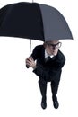 Business man hiding under an umbrella Royalty Free Stock Photo