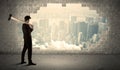 Business man hitting wall with hammer on city view Royalty Free Stock Photo