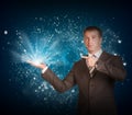 Business man hold magic light in hand Royalty Free Stock Photo