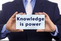 Business man hold paper knowledge is power on it Royalty Free Stock Photo