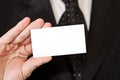 Business man holding blank businesscard