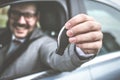 Business man holding car key. Royalty Free Stock Photo