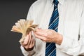 Business man is holding cash, fan of fifty euros. Person counts money. Businessman hands and euro bills Royalty Free Stock Photo