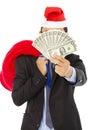 Business man holding a christmas gift bag and money Royalty Free Stock Photo