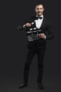 Business man holding a clapboard Royalty Free Stock Photo