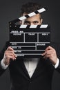 Business man holding a clapboard Royalty Free Stock Photo