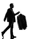 Business man holding dry clean clothes silhouette