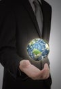 Business man holding earth in his hand Royalty Free Stock Photo