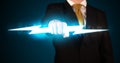 Business man holding glowing lightning bolt in his hands Royalty Free Stock Photo