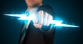 Business man holding glowing lightning bolt in his hands Royalty Free Stock Photo