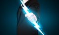 Business man holding glowing lightning bolt in his hands Royalty Free Stock Photo