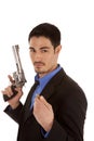 Business man holding gun and bullet