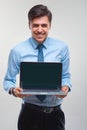 Business man holding a laptop against a white background Royalty Free Stock Photo