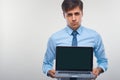 Business man holding a laptop against a white background Royalty Free Stock Photo