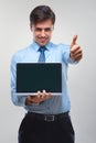 Business man holding a laptop against a white background Royalty Free Stock Photo