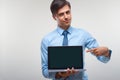 Business man holding a laptop against a white background Royalty Free Stock Photo
