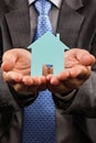 Business man holding a model of a house in his hands Royalty Free Stock Photo