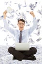 Business man holding money and raising hands Royalty Free Stock Photo