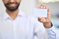 Business man holding namecard showing business card white mockup.