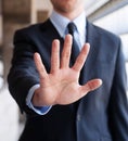 Business man holding out hand, indicating stop Royalty Free Stock Photo