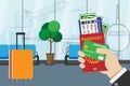 Business man holding passport, boarding pass , pocket money and credit card, prepare for travel with luggage and airport terminal