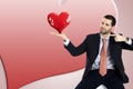 Business man is holding and pointing his heart Royalty Free Stock Photo