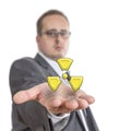 Business man holding radioactive Symbol