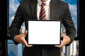 Business man holding and shows touch screen tablet with digital device, technology for smart working Royalty Free Stock Photo