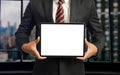 .Business man holding and shows touch screen tablet with digital device, technology for smart working concepts Royalty Free Stock Photo