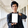 Business man holding and shows touch screen tablet pc Royalty Free Stock Photo