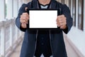 Business man holding and shows touch screen tablet pc Royalty Free Stock Photo