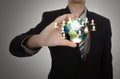 Business man holding the small world in his hands against Royalty Free Stock Photo