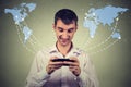 Business man holding smartphone connected browsing internet worldwide Royalty Free Stock Photo