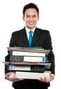 Business man holding stack of files and folders Royalty Free Stock Photo