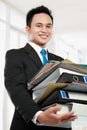 Business man holding stack of files and folders Royalty Free Stock Photo