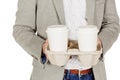 Business man holding a take out tray of disposable coffee cups. Royalty Free Stock Photo