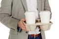 Business man holding a take out tray of disposable coffee cups. Royalty Free Stock Photo