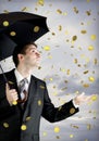Business man holding an umbrella, money falling Royalty Free Stock Photo