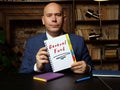 Business man holding white notepad with written text General Fund - closeup shot