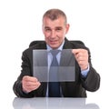 Business man holds a transparent pannel