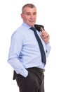 Business man with jacket over shoulder and hand in pocket Royalty Free Stock Photo