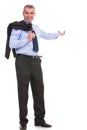 Business man with jacket over shoulder presents in the back Royalty Free Stock Photo