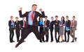 Business man jumping in front of his business team Royalty Free Stock Photo
