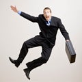 Business man jumps in the air Royalty Free Stock Photo