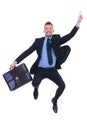 Business man jumps and points with suitcase Royalty Free Stock Photo