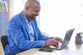 Business man, laptop and smile while typing communication, email or social media post at work. Black man, happy and